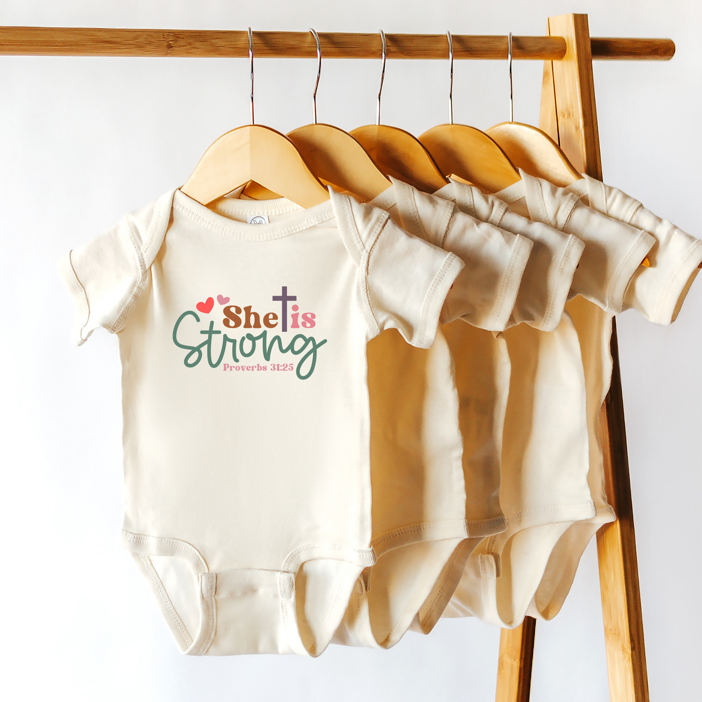 She is Strong infant Onesie